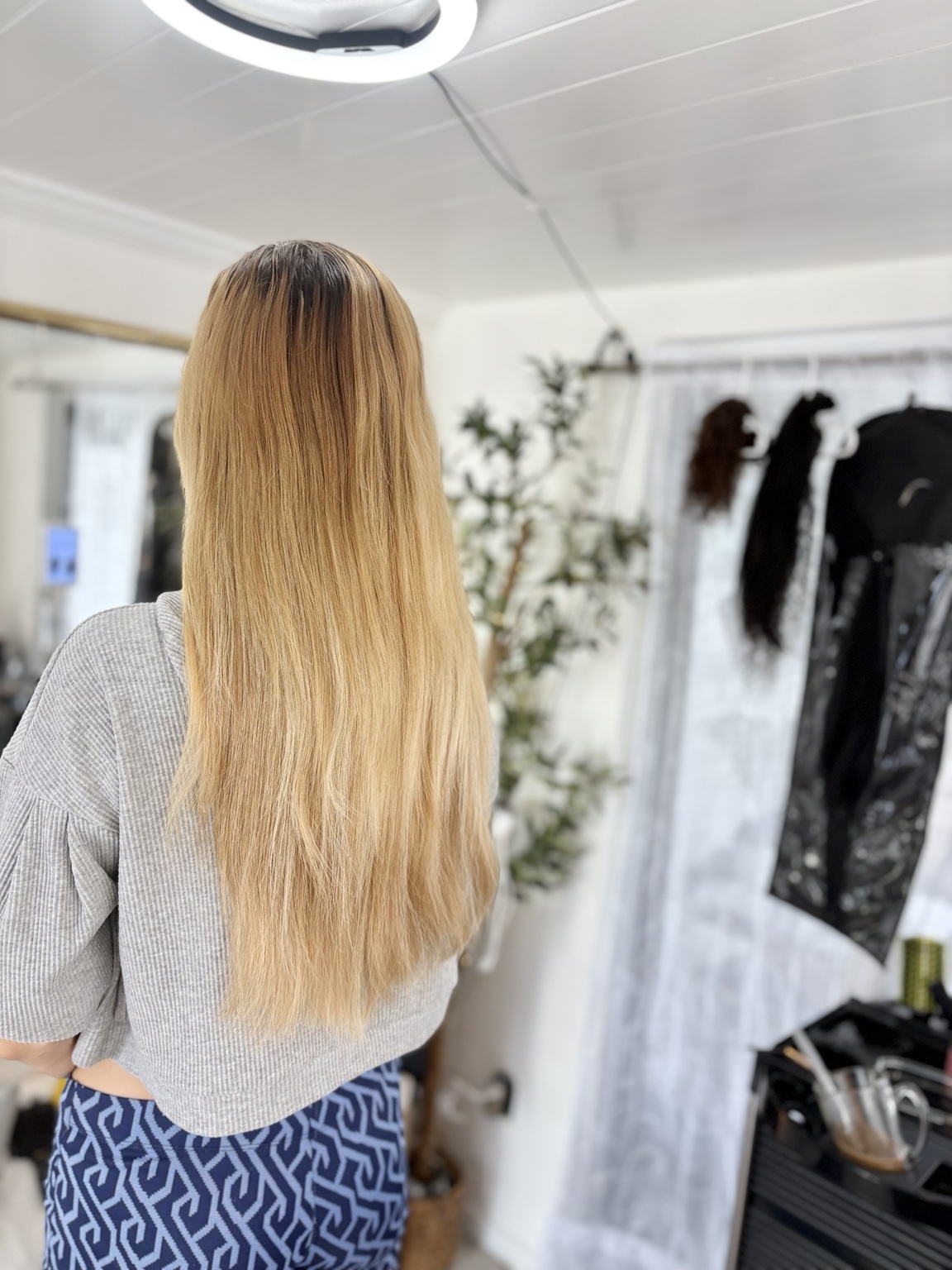 Finished blonde hair extension look at Erica's salon